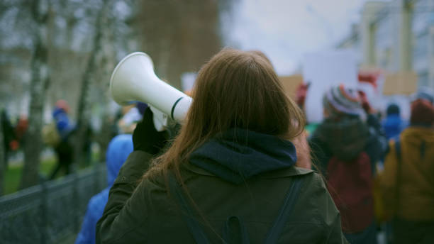 young woman at demonstration - on strike imagens e fotografias de stock