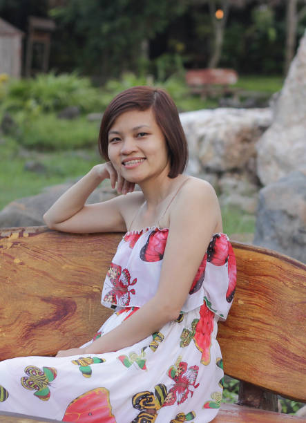 istock A beautiful woman is sitting in the bench 1766321787