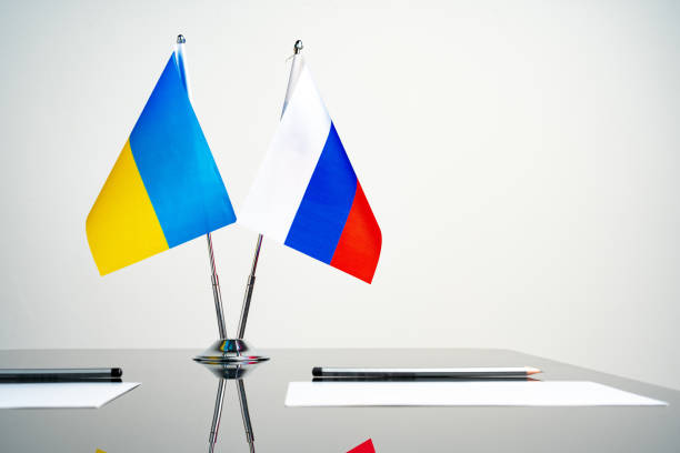 istock Russia and Ukraine flags on negotiation table 1766357843