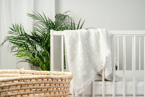 istock Baby bed and basket in nursery room interior 1766357846