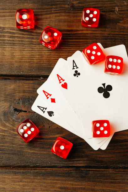 istock Playing cards and dice cubes on wooden background 1766371365