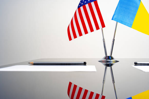 istock USA and Ukraine flags on negotiation table 1766373403