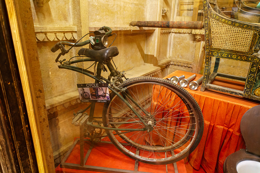 Jaisalmer, Rajasthan, India. September 21, 2023: Ancient Designs of Patwon Ki Haveli. Some everyday items of ancient design. Folding bicycle.