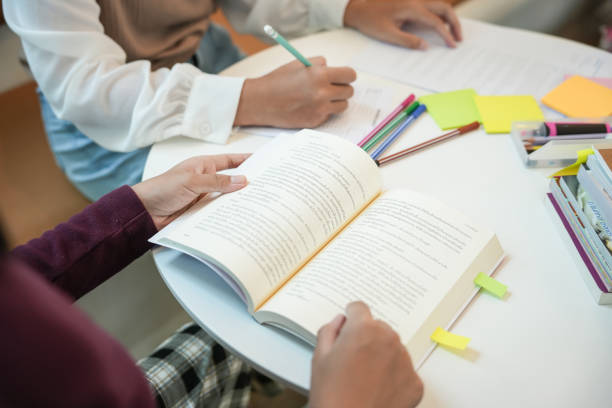 istock Learning with friends Young students campus
High School Tutor for examining helps school homework together withÂ friend catching up and learning 1766407786