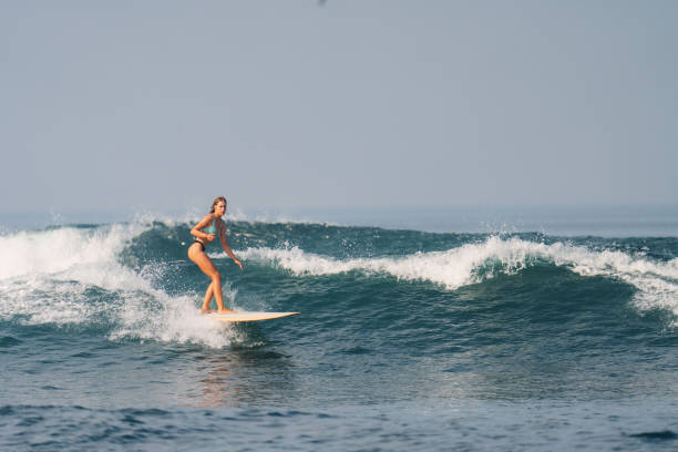 istock Athletic Blonde White Woman Surfing 1766412740