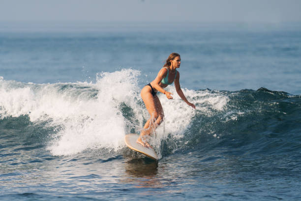 istock Athletic Blonde White Woman Surfing 1766414882