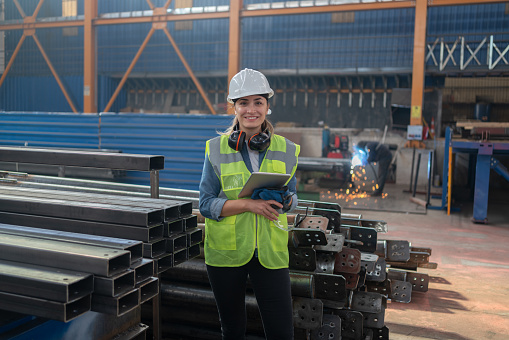 Portrait Of Female Engineer In An Industrial Factory
