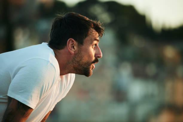 istock Young male athlete taking a break from sports training. 1766457380