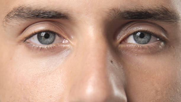 istock Serious sad man blue eyes close up. Handsome european guy look at camera. 1766460579