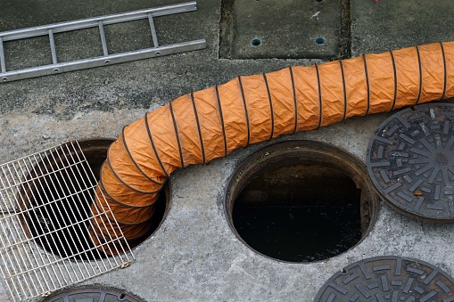 A air intake pipe in the drainage system on the street in the city for maintain or cleanning.