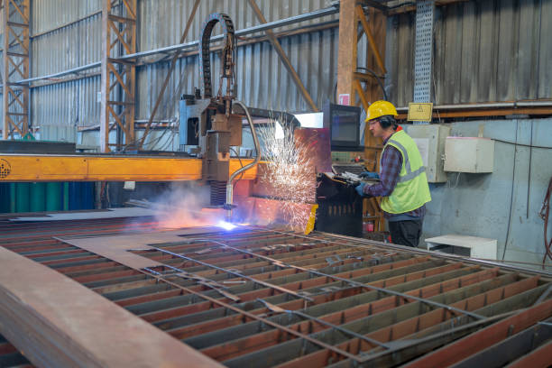 istock Steel Worker On CNC Laser Cutter Machine In A Factory 1766475762