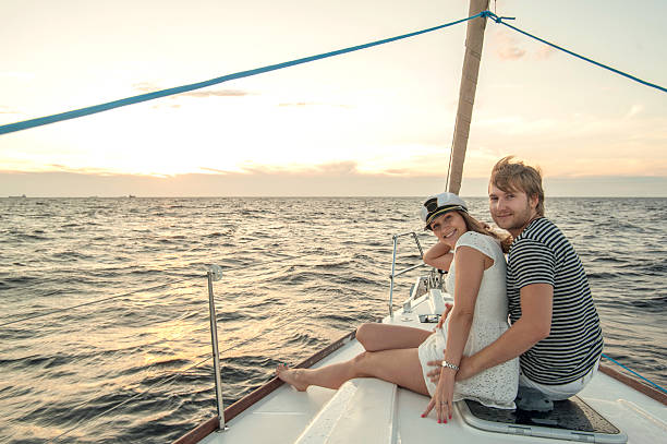 istock Happy young couple relaxing on a yacht 176647599