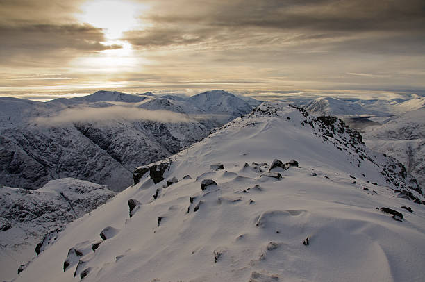 Glencoe mountains in WInter Looking west from summit of Buachaille Etive Beag in winter with a covering of fresh snow buachaille etive beag photos stock pictures, royalty-free photos & images