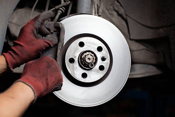 istock Mechsning changing brake pads of car 176647901