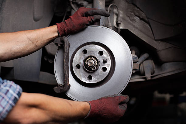 istock Car mechanic Repairing brakes 176647917