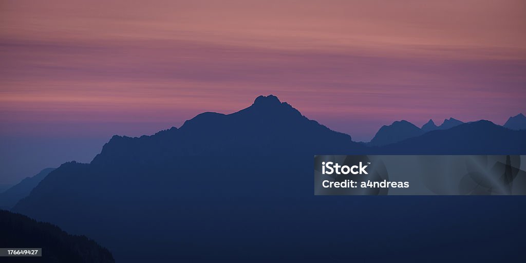 silhouette di montagna austriaco - Foto stock royalty-free di Alba - Crepuscolo