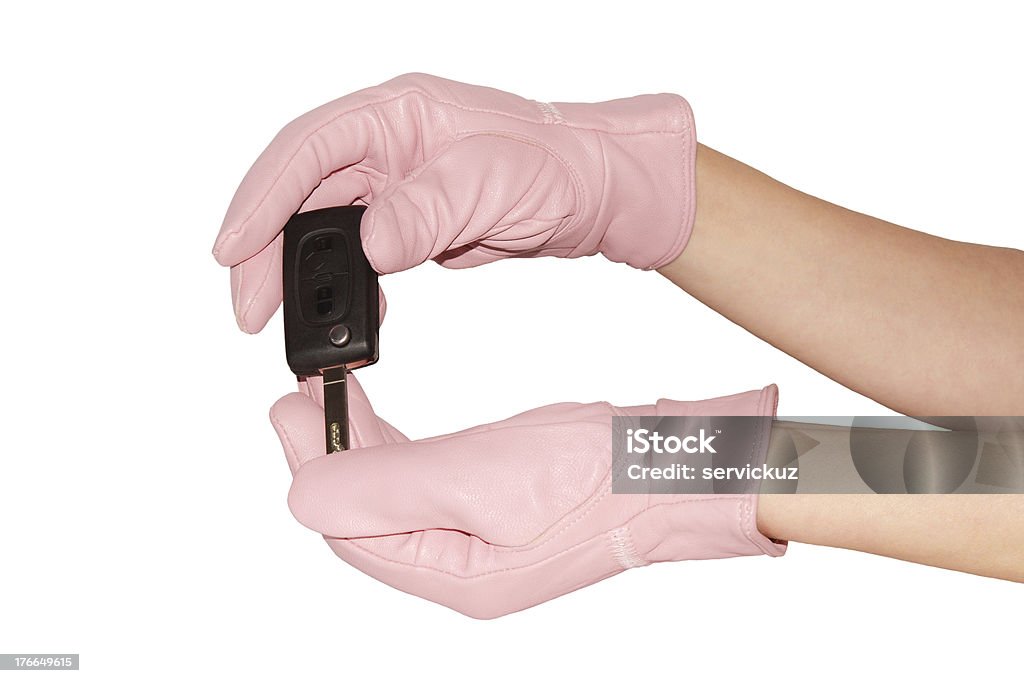Clé de voiture dans d'élégants gants roses - Photo de Alarme libre de droits