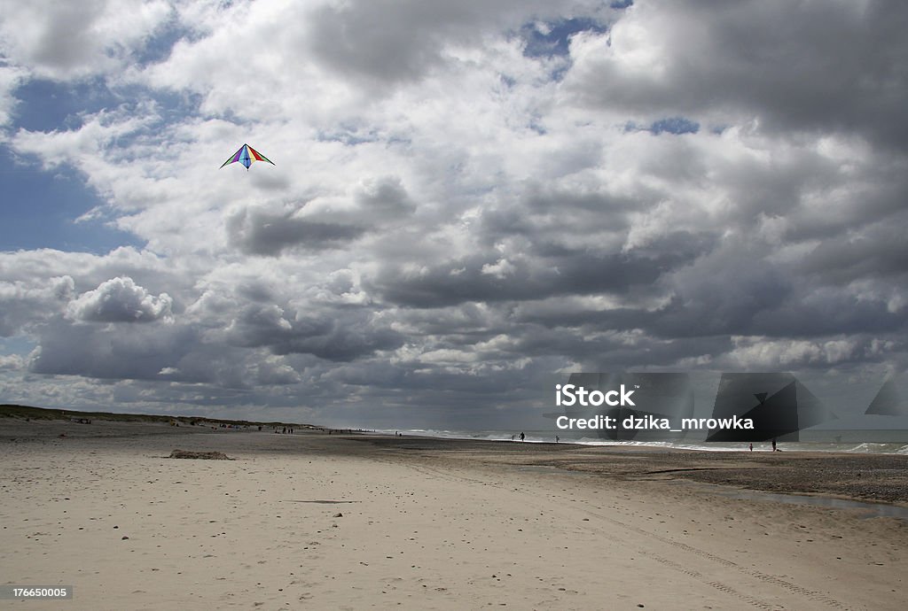 Kite surfing at beach of North Sea, Denmark Kite surfing at beach of North Sea, Denmark. Activity Stock Photo