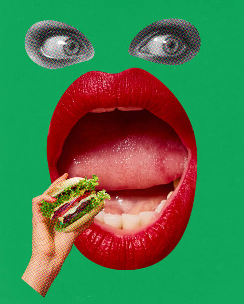 Wide open female mouth with red lipstick eating burger over green background. Fast food lover. Contemporary art collage. Wide open female mouth with red lipstick eating burger over green background. Fast food lover. Contemporary art collage. Concept of food, taste, surrealism, creativity. Pop art style. Poster, ad big fat lips stock pictures, royalty-free photos & images