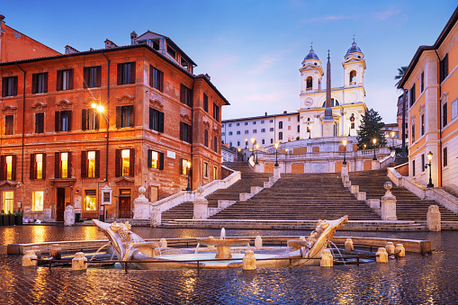 Piazza di Spagna square in Rome, Italy. Fontana della Barcaccia and Spanish Stepsat in Rome at sunrise.