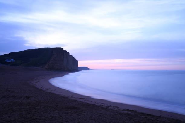 Footprints in the sand at Hive beach, Bridport, Dorset