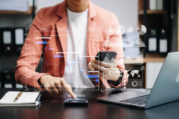 istock Businessman hand Project manager working and update tasks and Gantt chart scheduling virtual diagram.with smart phone, tablet and laptop 1766523112