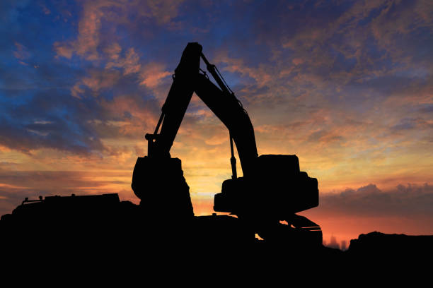 istock Crawler excavators silhouette are digging the soil 1766536331