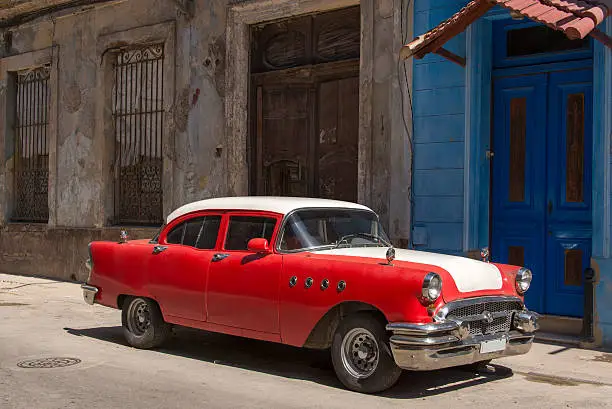 Old red car in the streets of Havana, Cuba.