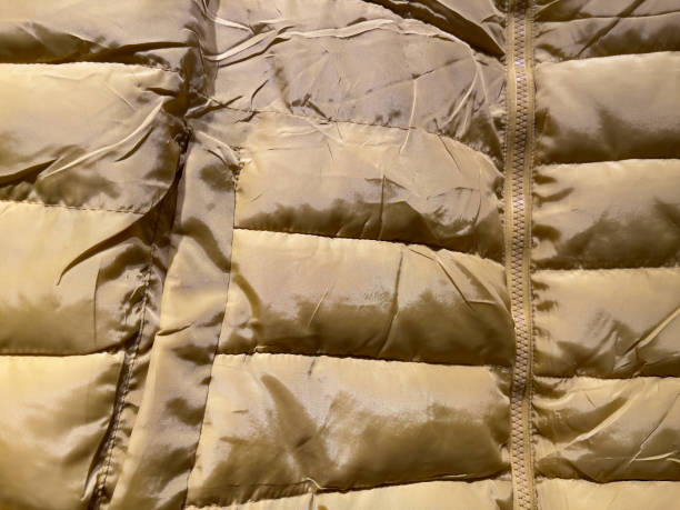 istock Texture of a brown down jacket, close-up. Abstract background 1766544655