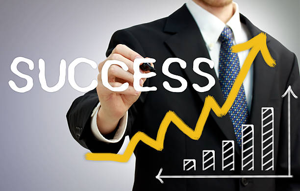 istock Businessman writing success with a rising arrow 176654582
