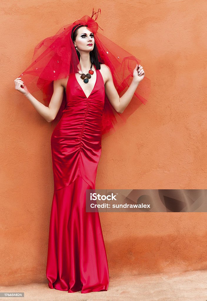 Beautiful young woman in a red dress Adult Stock Photo