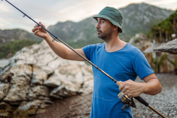 istock Man fishing at beach for relaxation 1766557820