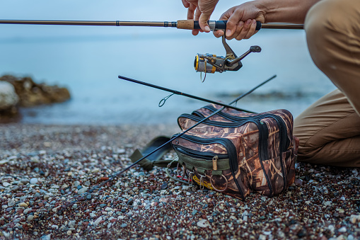 Man fishing at beach for relaxation