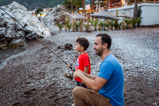 Man fishing at beach for relaxation