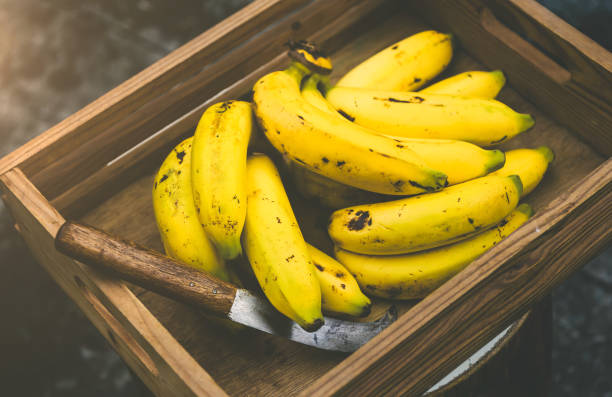 istock Ripe bananas in a wooden container 1766581010
