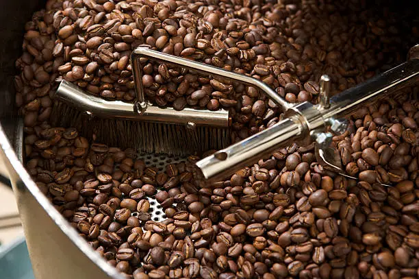 Photo of coffee beans in a roaster