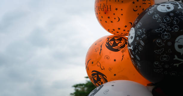 istock Black, white and orange balloons decoration for Halloween. 1766584213