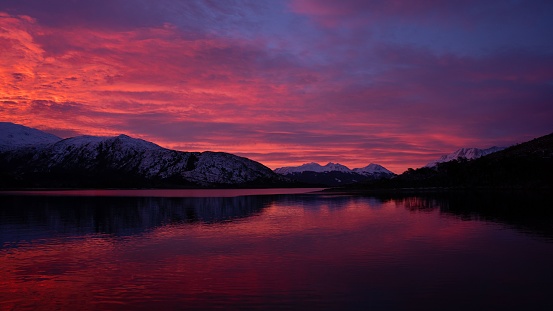 A dramatic sunset over the majestic Patagonian fjords in South America