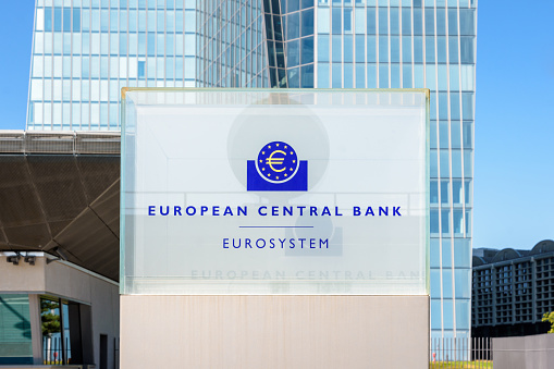 Frankfurt am Main, Germany - August 20, 2023: Close-up view of the sign and logo of the European Central Bank at the southern entrance of the Skytower building, headquarters of the ECB since 2015.