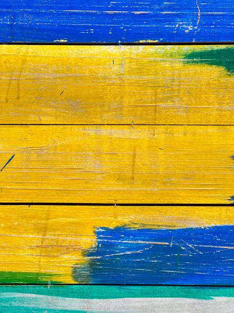 istock Green, yellow, blue on wood texture and background 1766601659
