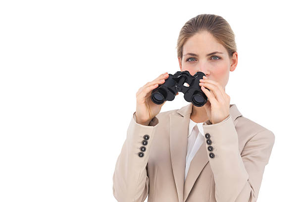 istock Businesswoman with binoculars 176660383