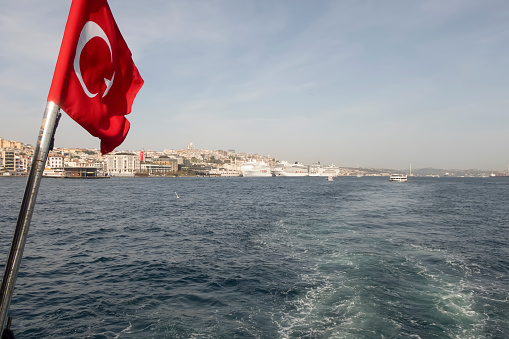 Uckuyular, Izmir, Turkey, Sept.7, 2023: A ferry operated by izdeniz, affiliated with İzmir metropolitan municipality, approaches to Karsiyaka Pier. Karsiyaka is one of the tourist districts of Izmir.