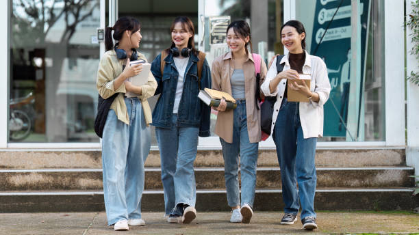 istock Group of Young Asian student walking and talking at university before class room. education, back to school concept 1766610081