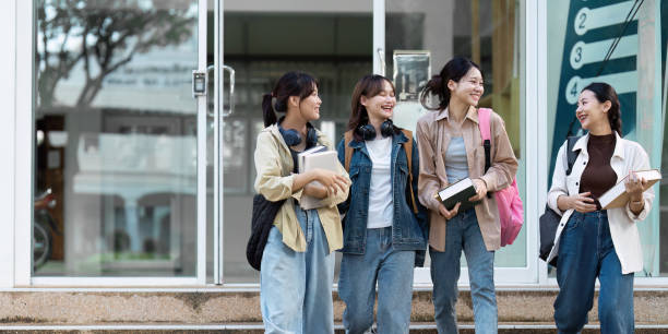 istock Group of Young Asian student walking and talking at university before class room. education, back to school concept 1766610430