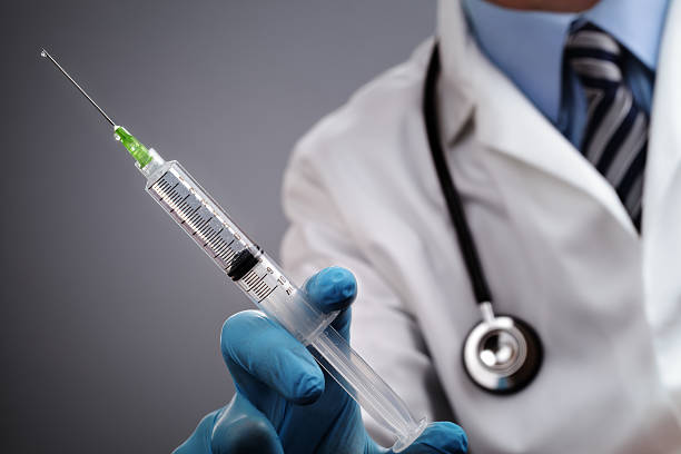 istock A medical professional with a loaded syringe and stethoscope 176661804