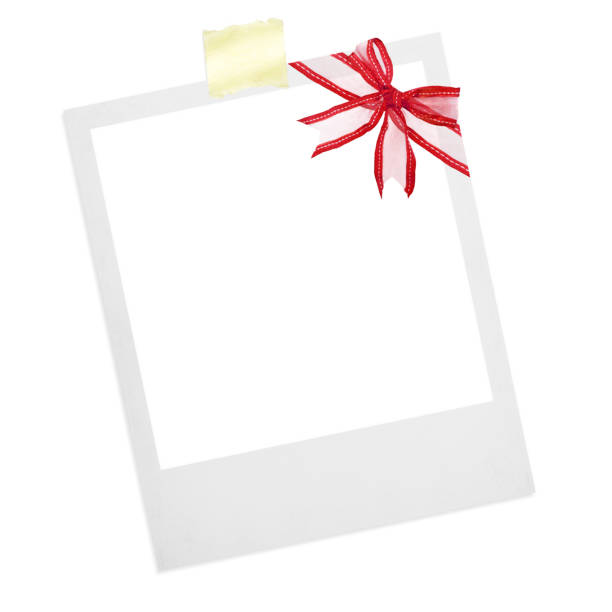 a polaroid card blank with red ribbon for Christmas stock photo