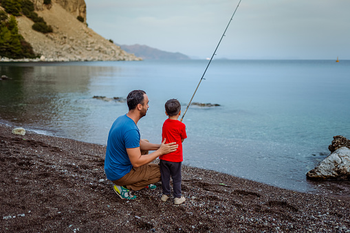 Man fishing at beach for relaxation