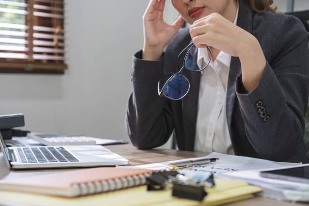 istock Confused Asian woman is seriously stressed about how to fix laptop screen problem. Serious Asian businesswoman worried focused on solving difficult computer tasks 1766629252