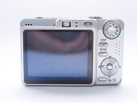 back view of silver digital pocket camera isolated on white background