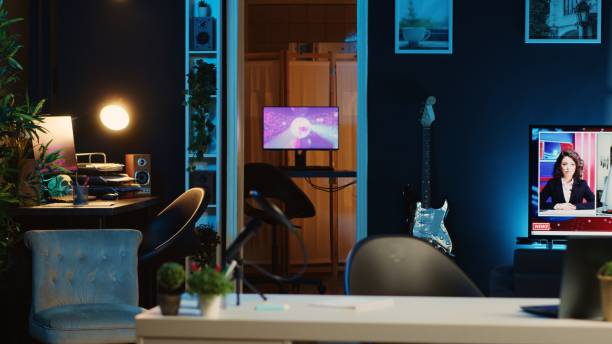 istock 3D renders on computers in living room 1766632052